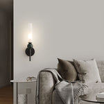 Elegant wall sconce with frosted glass shade, black marble accent, and a modern brushed gold finish.
