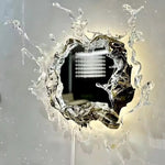 Elegant wall mirror with splash-shaped frame and integrated LED lighting, perfect for modern décor.
