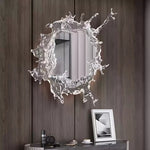 Elegant wall mirror with splash-shaped frame and integrated LED lighting, perfect for modern décor.
