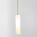 Elegant linear glass pendant light with sleek modern design, ideal for dining rooms, kitchens, and contemporary interiors.