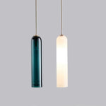 Elegant linear glass pendant light with sleek modern design, ideal for dining rooms, kitchens, and contemporary interiors.