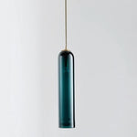 Elegant linear glass pendant light with sleek modern design, ideal for dining rooms, kitchens, and contemporary interiors.