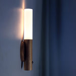 Smart motion sensor wall sconce with sleek modern design, perfect for energy-efficient lighting in entryways, hallways, and outdoor spaces