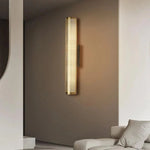 Luxury wall sconce with a sleek, modern design and warm ambient lighting, perfect for elegant bedrooms, living rooms, and hallways.