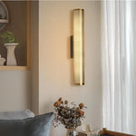 Luxury wall sconce with a sleek, modern design and warm ambient lighting, perfect for elegant bedrooms, living rooms, and hallways.