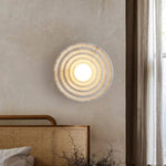 Koros Wall Sconce - Sculptural luxury wall lighting with ripple design, warm ambient glow, and premium craftsmanship for modern and elegant interiors.